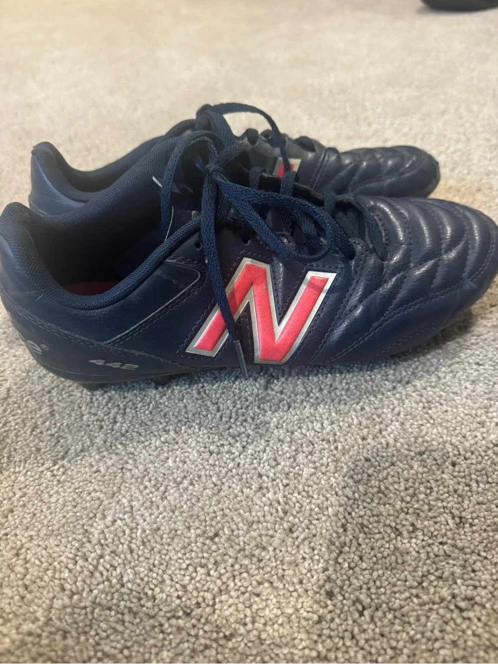 New Balance Men's Navy Athletic Cleats with Red Accent
